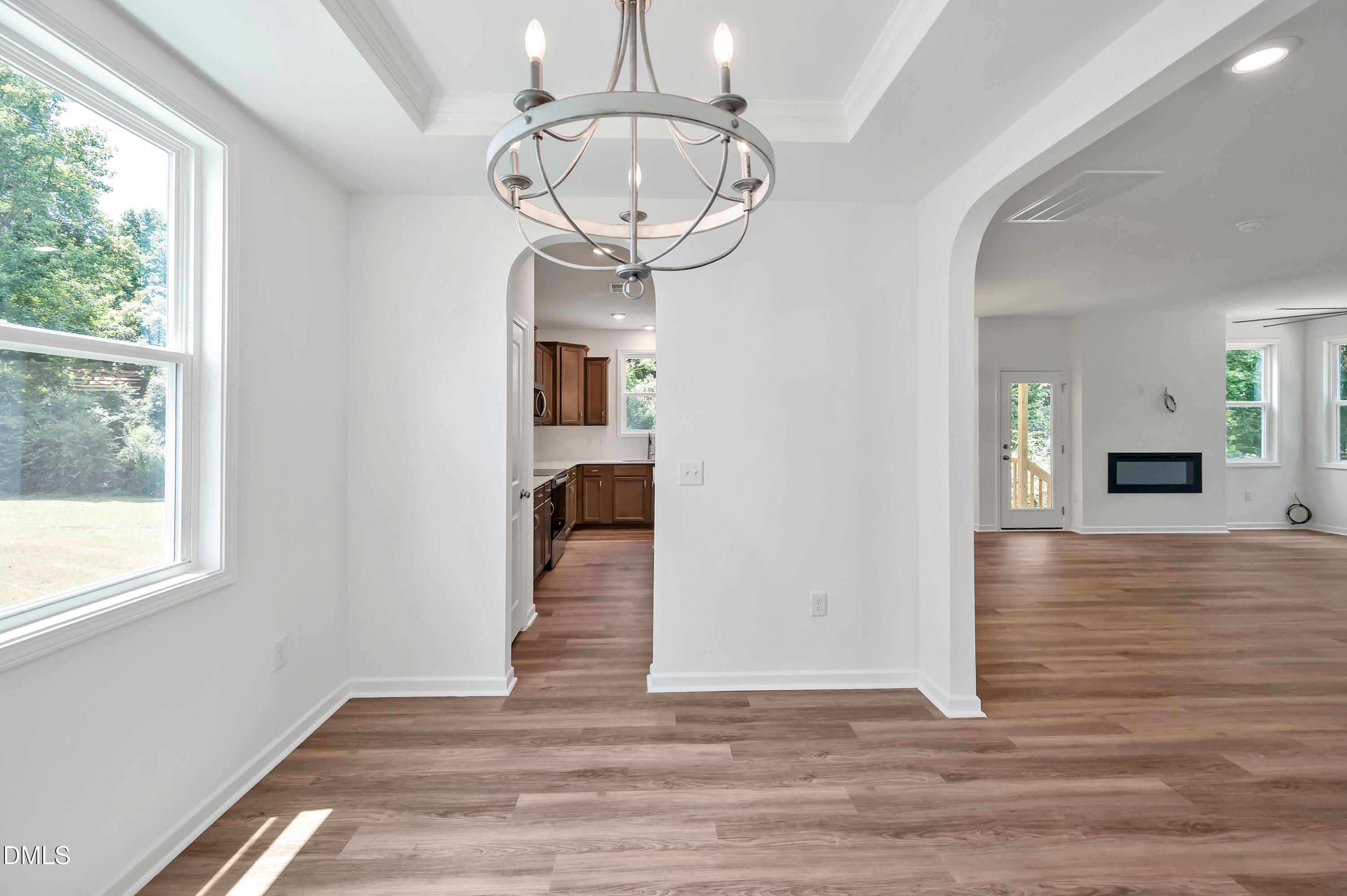 236 White Azalea Way Benson, NC 27504 - Photo 11 of 18 a view of entryway and hall with wooden floor