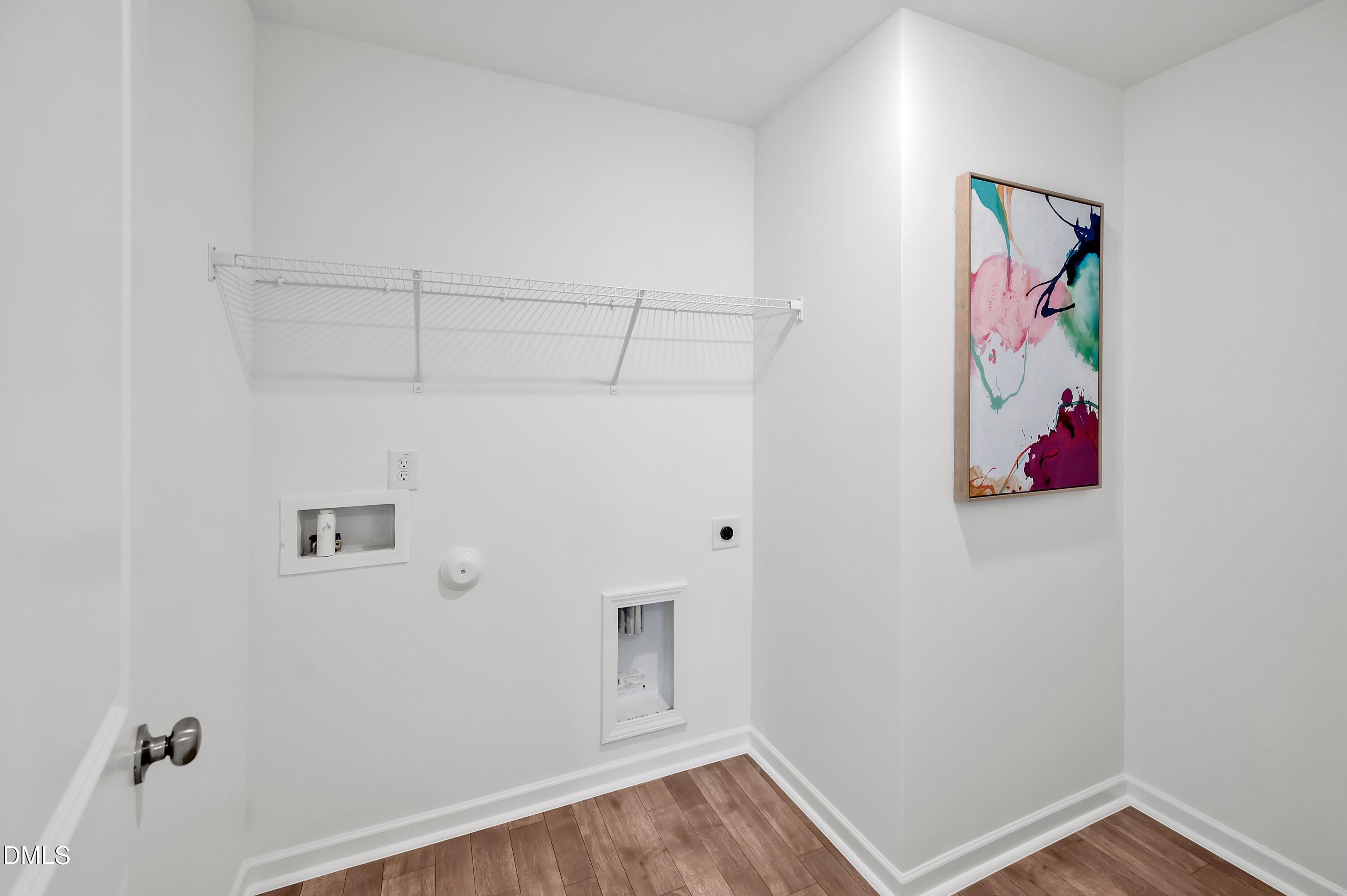 236 White Azalea Way Benson, NC 27504 - Photo 17 of 18 a view of a storage & utility room with wooden floor