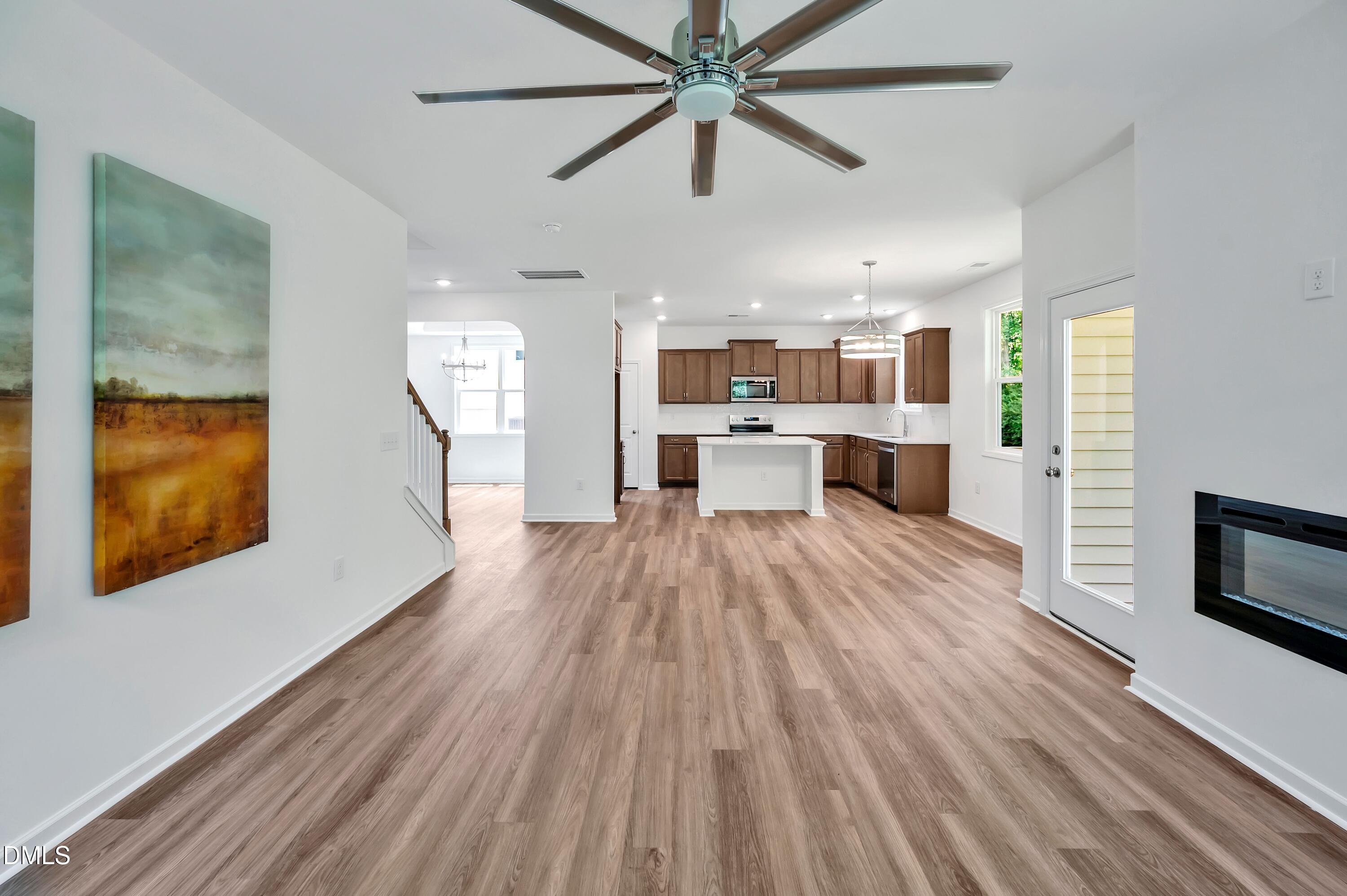 236 White Azalea Way Benson, NC 27504 - Photo 10 of 18 a large kitchen with a lot of counter space and a wooden floor