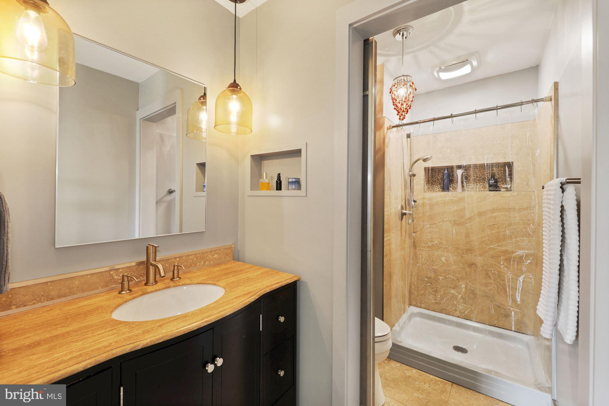 2425 Michigan Avenue Silver Spring, MD 20910 - Photo 17 of 30 Custom barn door w/glass inset separates shower