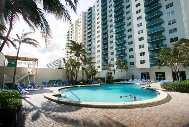 a view of a swimming pool with a house