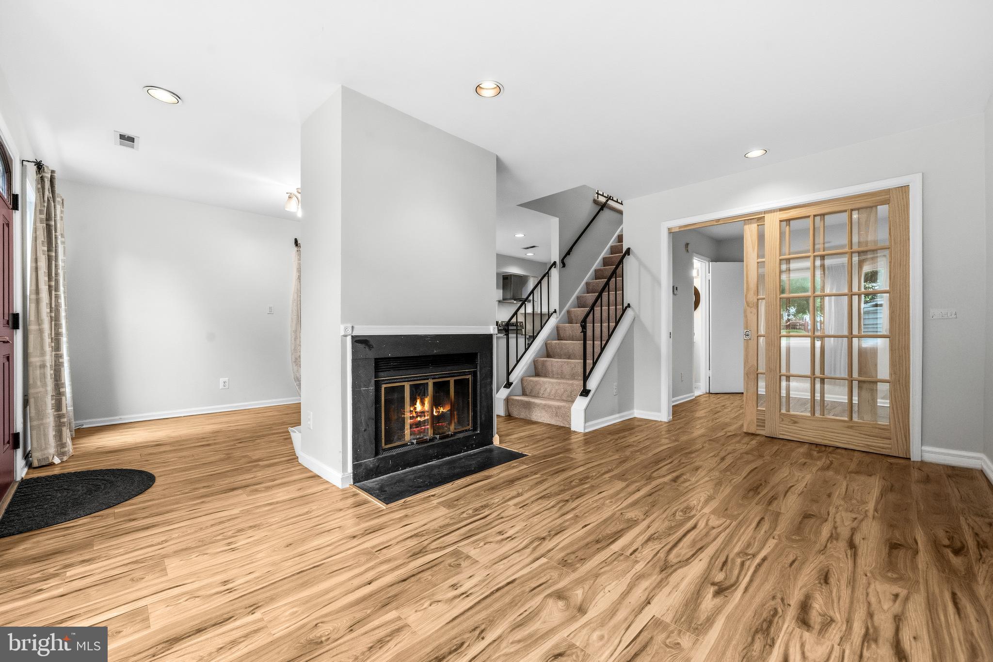 6001 Rabbit Hill Court Centreville, VA 20121 - Photo 5 of 46 a view of empty room with wooden floor and a fireplace