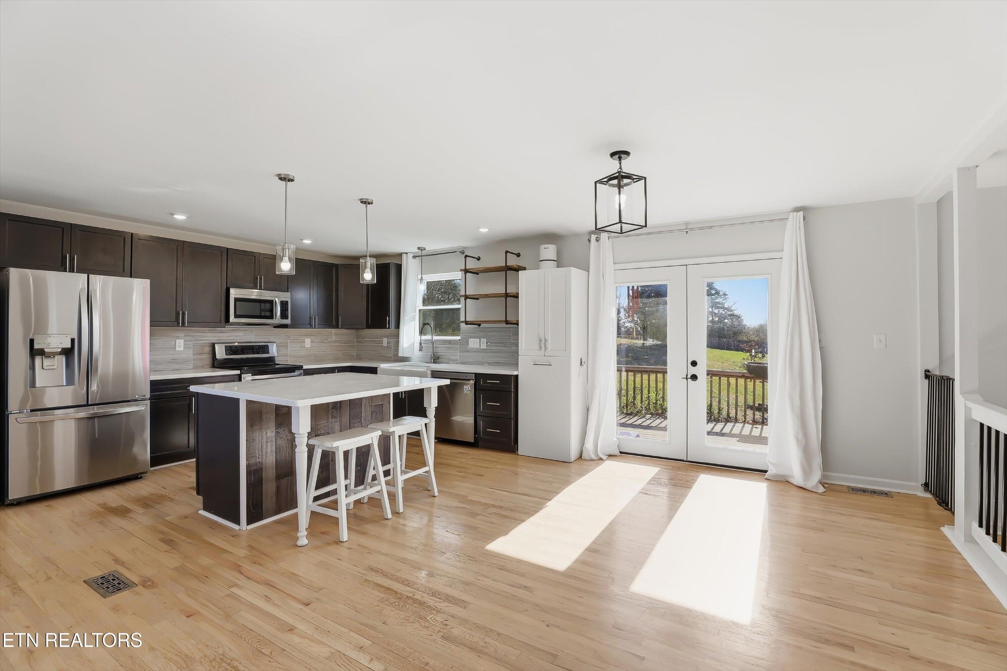 6120 Cline Road Knoxville, TN 37938 - Photo 8 of 29 a kitchen with stainless steel appliances kitchen island granite countertop a refrigerator and a stove top oven