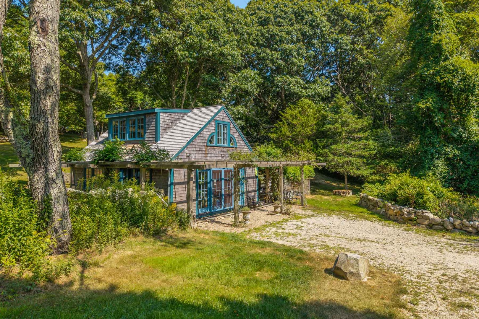 85 North Reservoir Road Vineyard Haven, MA 02568 - Photo 40 of 42 a view of a house with a yard and sitting area