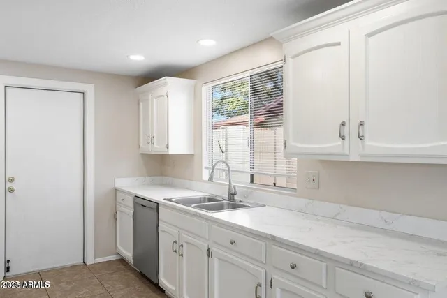 a view of a kitchen with a sink