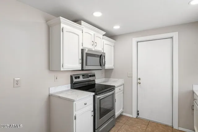 a kitchen with sink cabinets and window