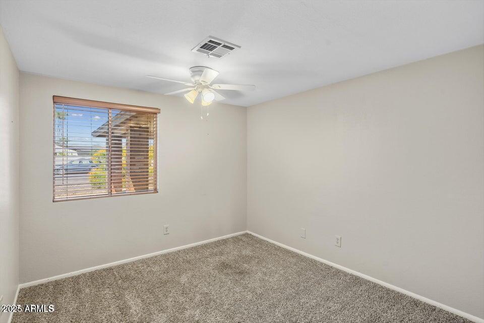 1525 West El Alba Way Chandler, AZ 85224 - Photo 20 of 33 wooden floor in an empty room with a window