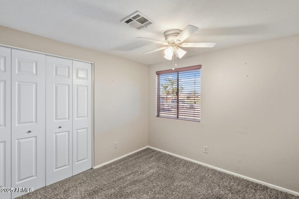 1525 West El Alba Way Chandler, AZ 85224 - Photo 21 of 33 an empty room with windows and fan