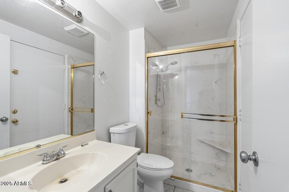 1525 West El Alba Way Chandler, AZ 85224 - Photo 25 of 33 a bathroom with a sink toilet and shower