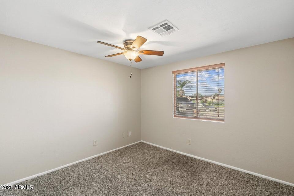 1525 West El Alba Way Chandler, AZ 85224 - Photo 28 of 33 an empty room with a window and a fan