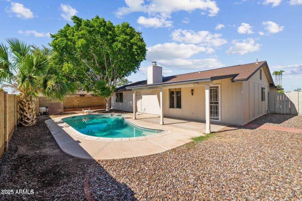 1525 West El Alba Way Chandler, AZ 85224 - Photo 32 of 33 a front view of a house with a yard