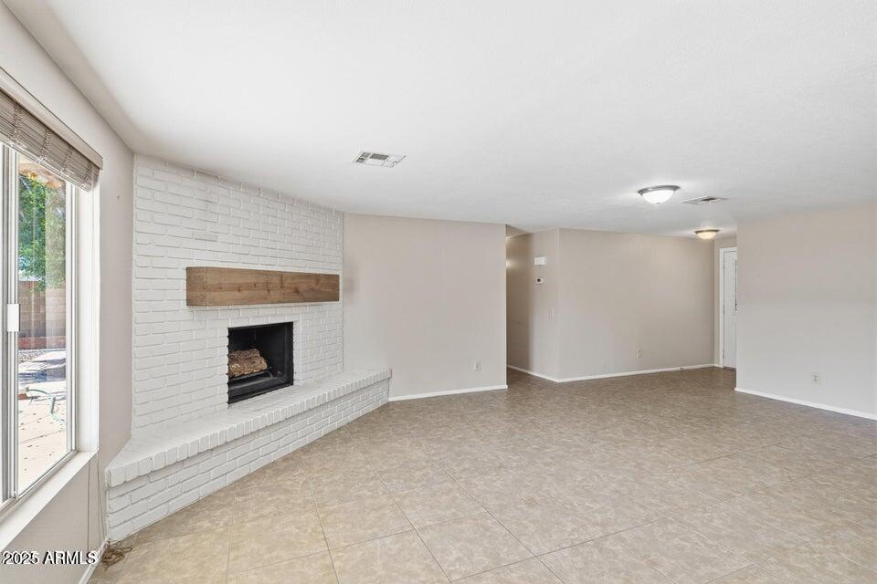 1525 West El Alba Way Chandler, AZ 85224 - Photo 10 of 33 a view of empty room with a fireplace