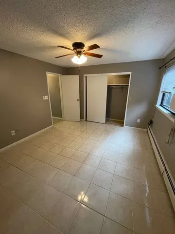 an empty room with a fireplace