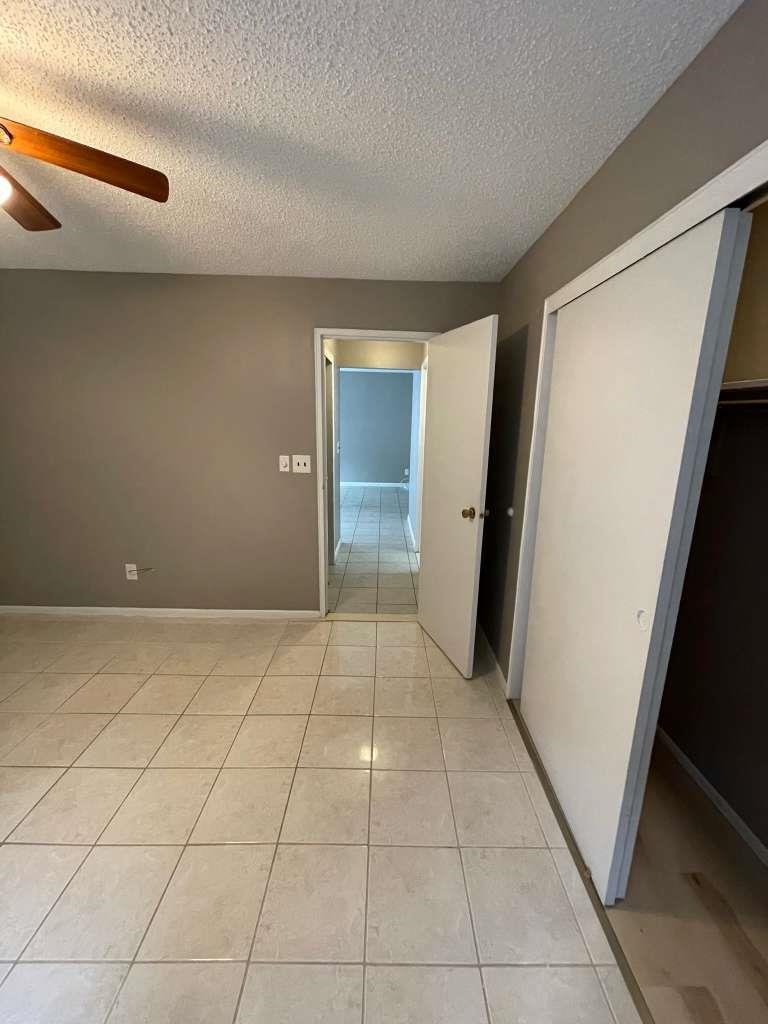 17 68th Street, Unit 7 Guttenberg, NJ 07093 - Photo 26 of 30 a view of a livingroom with an empty space and a refrigerator