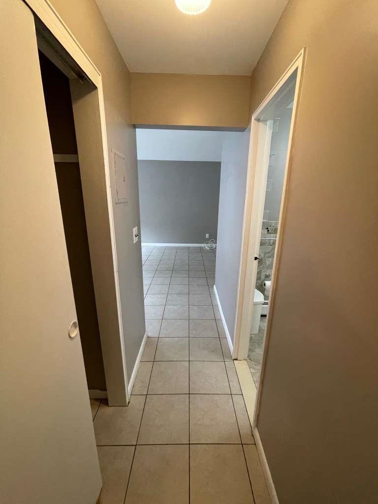 17 68th Street, Unit 7 Guttenberg, NJ 07093 - Photo 28 of 30 a view of hallway with stairs and a window