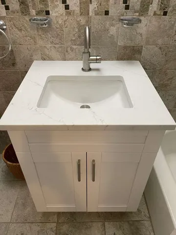 a bathroom with a bathtub and a sink