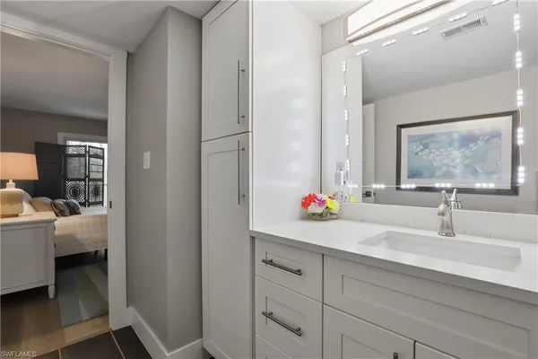 a bathroom with a sink and a mirror