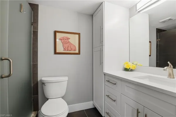 a bathroom with a toilet and a sink