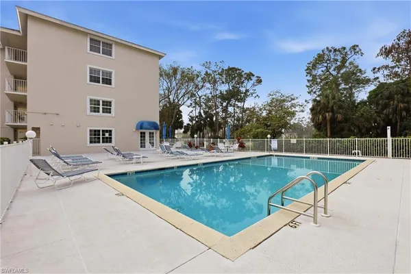 a view of a swimming pool with a patio