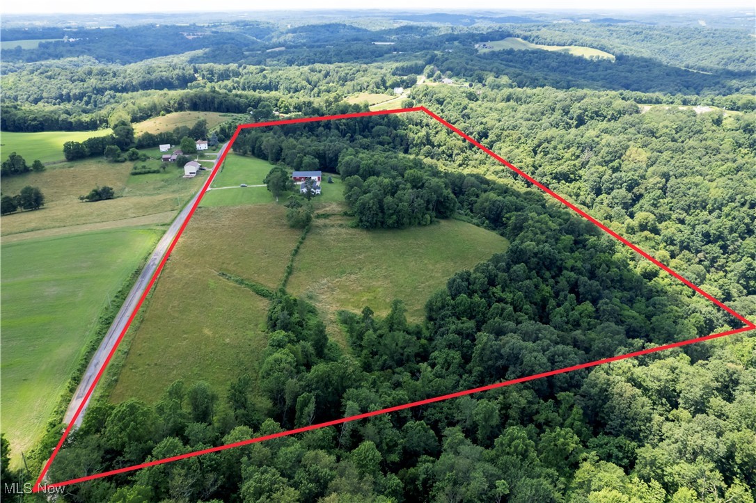 1292 Cinder Road Southeast Carrollton, OH 44615 - Photo 10 of 42 Aerial view of sparsely populated area with a heavily wooded area and property parcel outlined