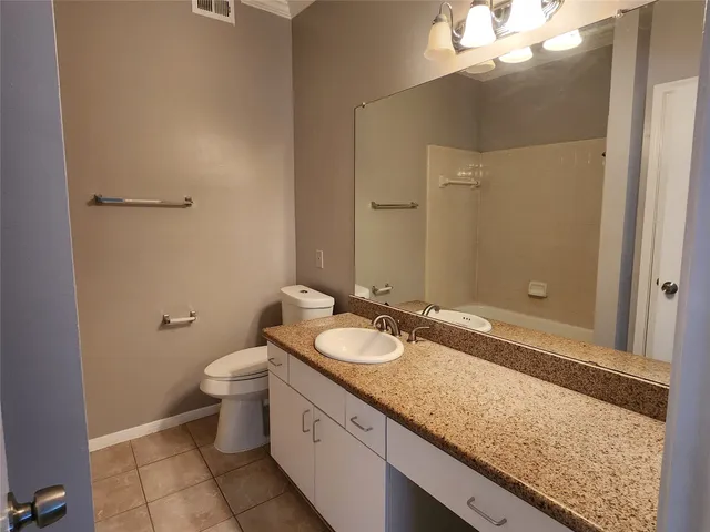 a view of a brick wall with an empty room