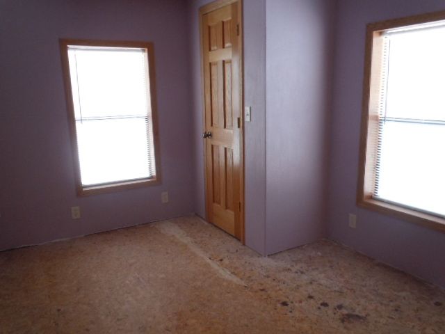 10948 Moate Road Durand, IL 61024 - Photo 8 of 12 an empty room with windows