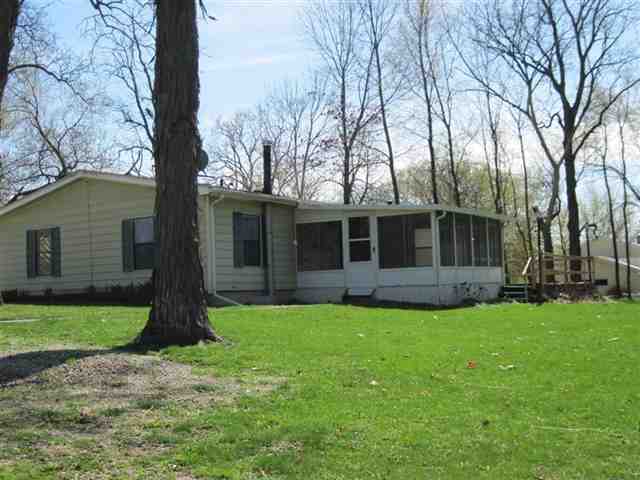 10948 Moate Road Durand, IL 61024 - Photo 10 of 12 a front view of a house with garden