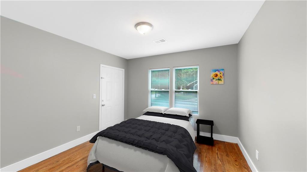 1333 Campbellton Road Southwest Atlanta, GA 30310 - Photo 17 of 21 a bedroom with a bed and a window