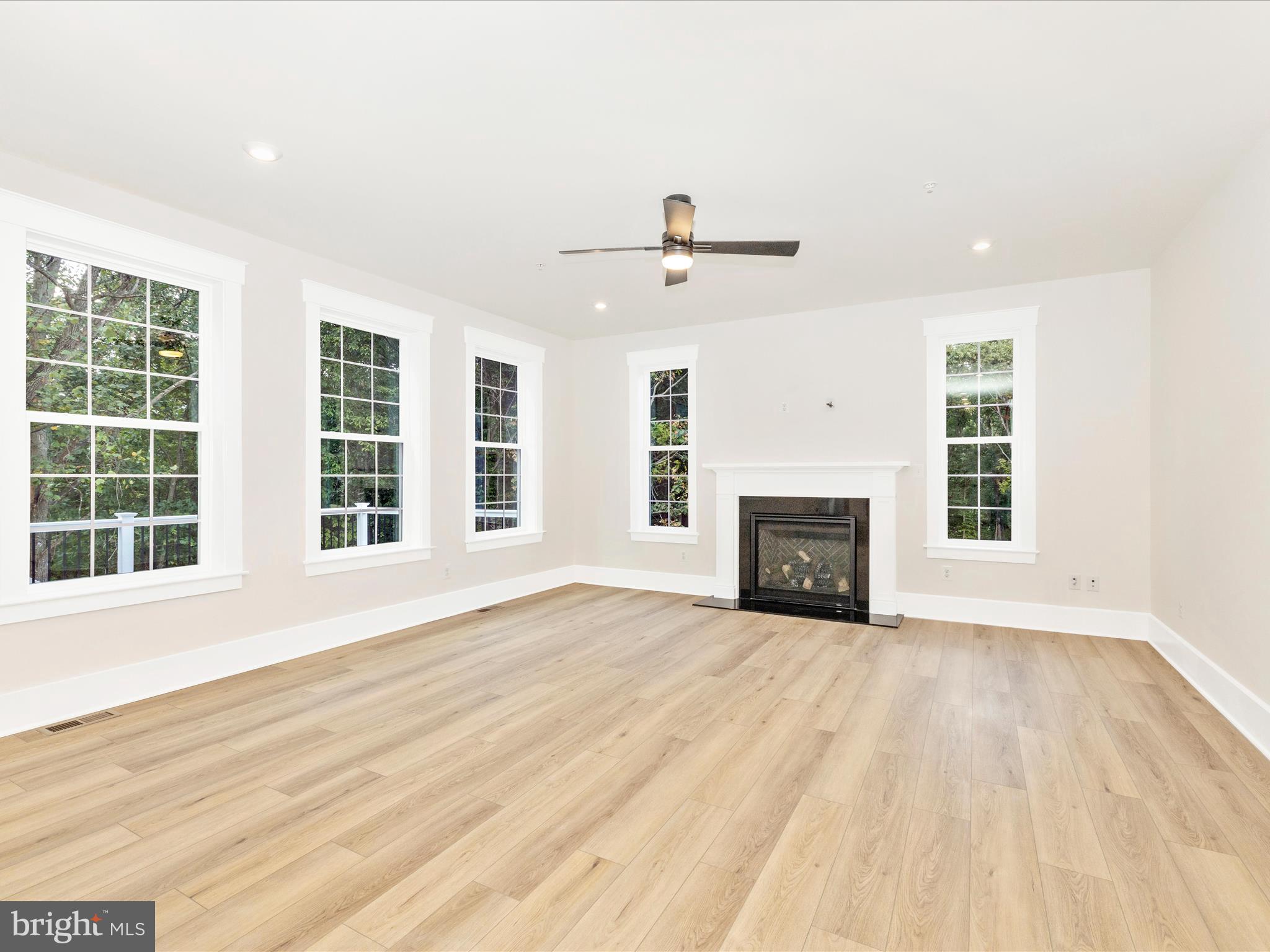 3105 Sumantown Road Middletown, MD 21769 - Photo 17 of 45 a view of an empty room with wooden floor and a window