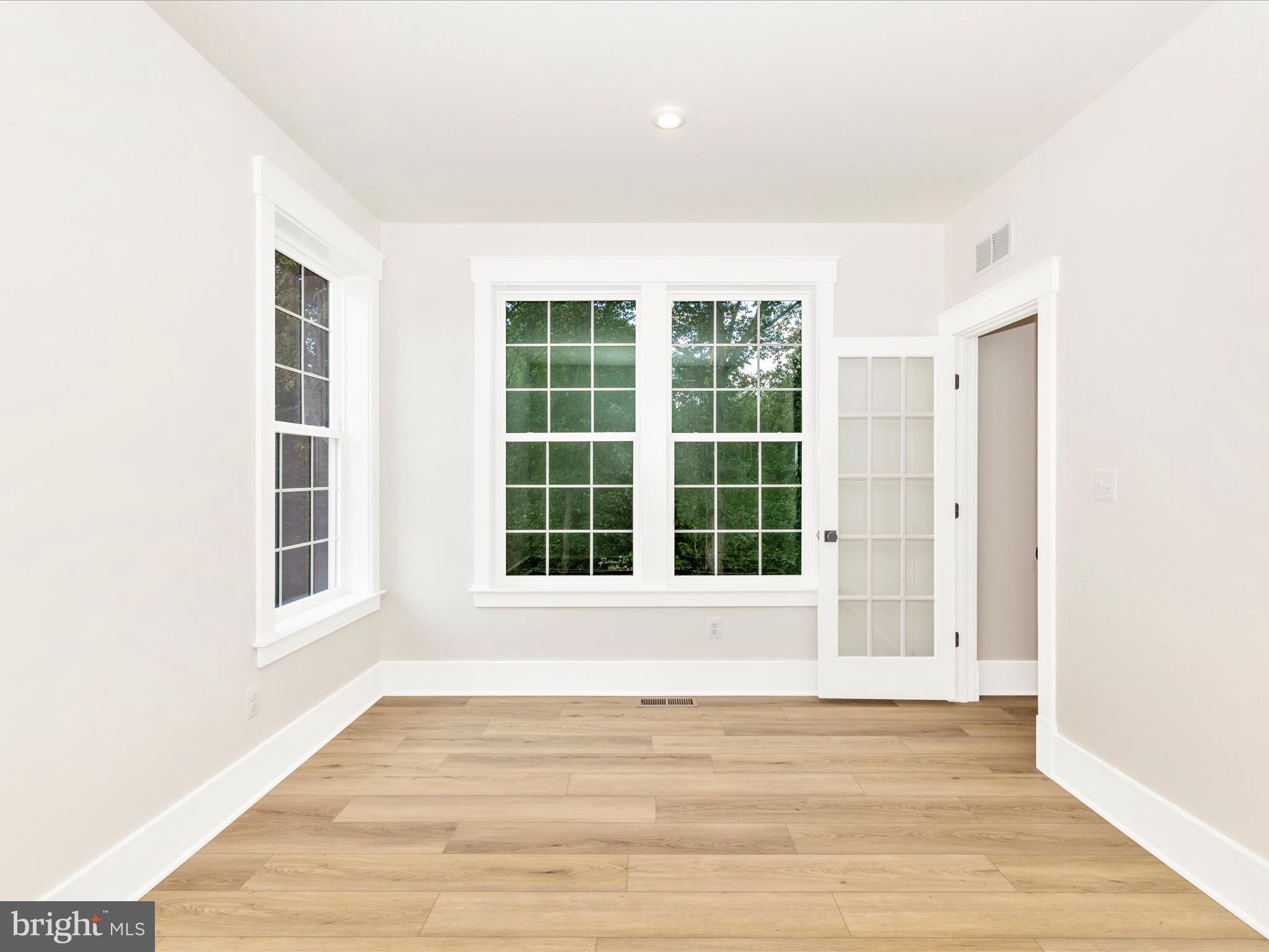 3105 Sumantown Road Middletown, MD 21769 - Photo 20 of 45 a view of an empty room with wooden floor and a window