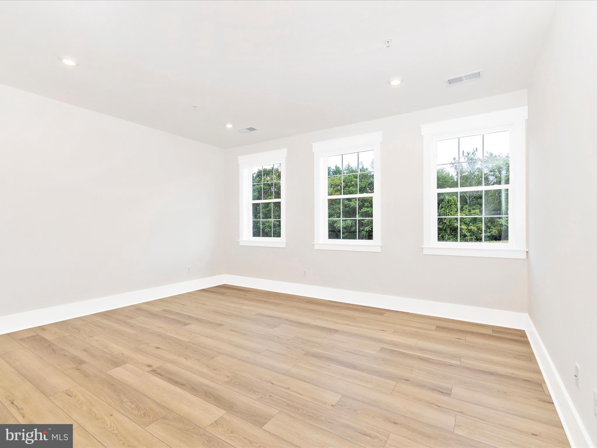 3105 Sumantown Road Middletown, MD 21769 - Photo 21 of 45 an empty room with wooden floor and windows