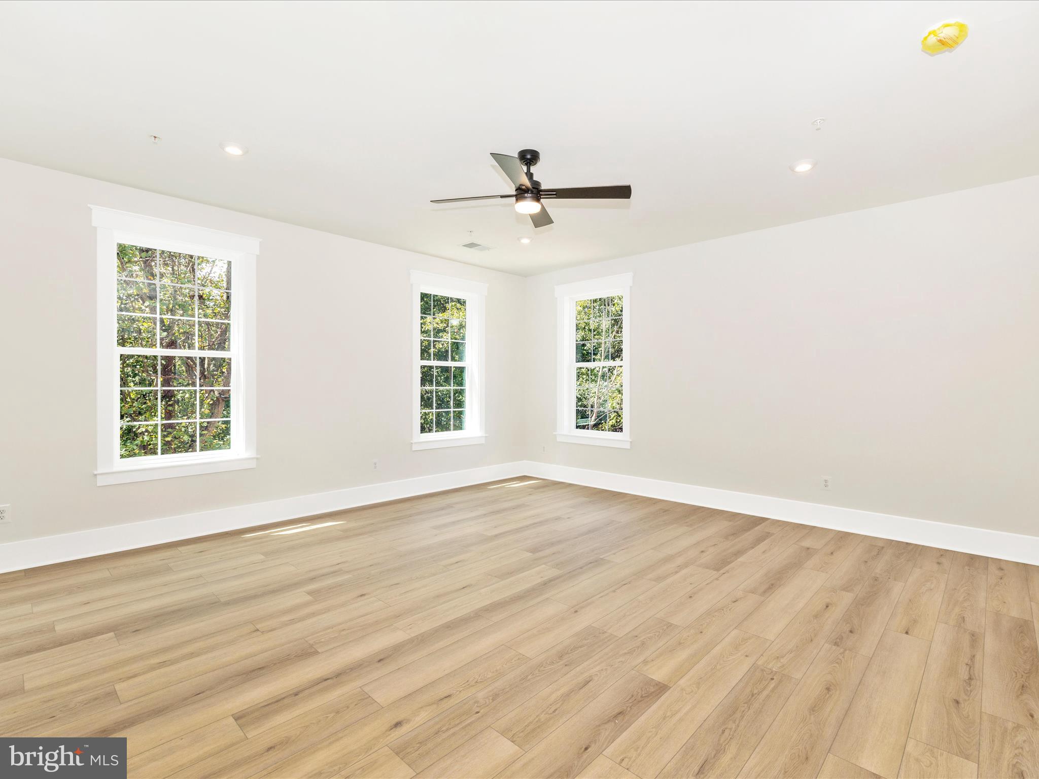 3105 Sumantown Road Middletown, MD 21769 - Photo 24 of 45 an empty room with wooden floor and windows