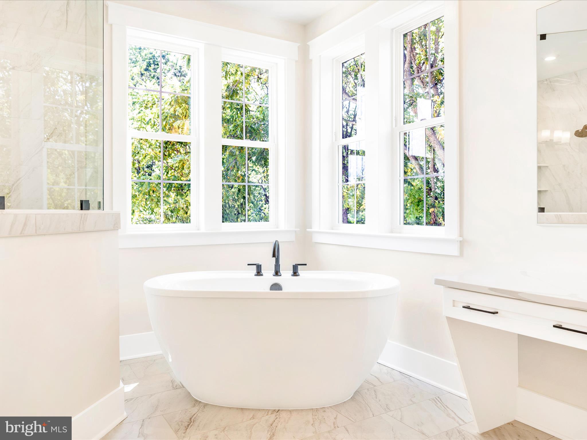 3105 Sumantown Road Middletown, MD 21769 - Photo 29 of 45 a white bath tub sitting in a bathroom next to a window
