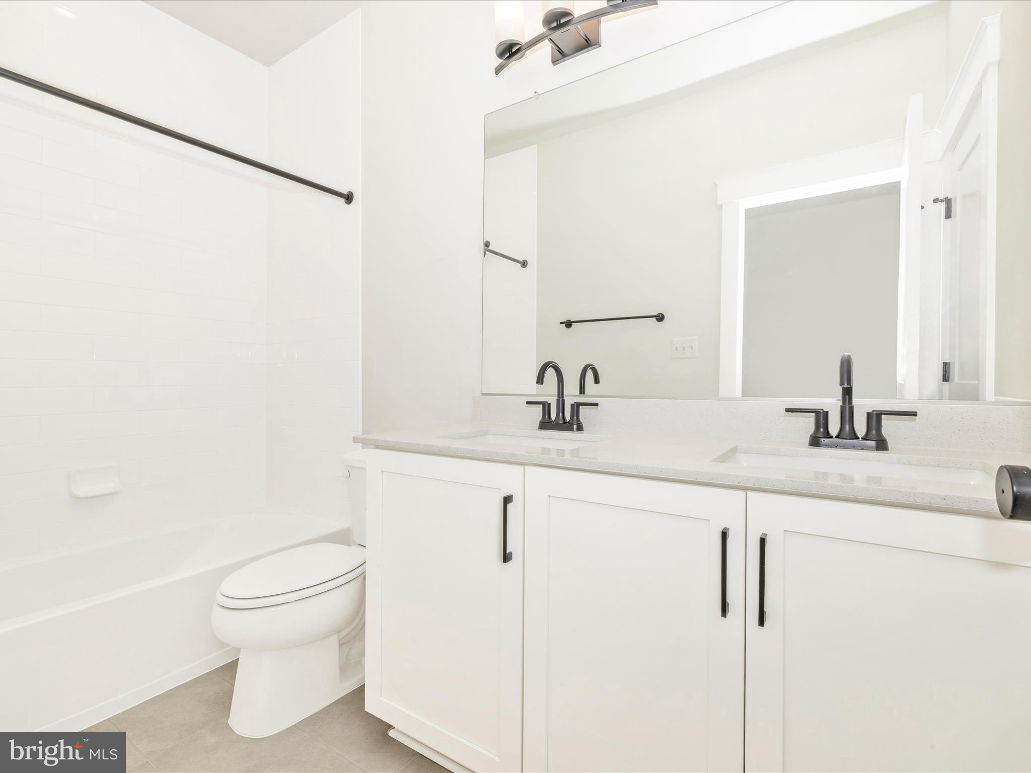 3105 Sumantown Road Middletown, MD 21769 - Photo 34 of 45 a bathroom with a toilet sink and mirror