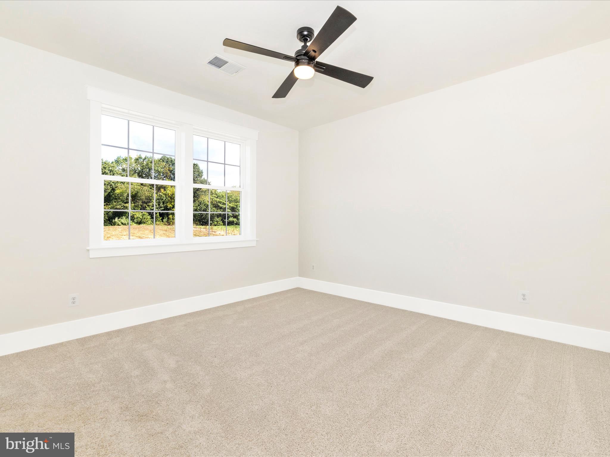 3105 Sumantown Road Middletown, MD 21769 - Photo 35 of 45 an empty room with a window and a fan