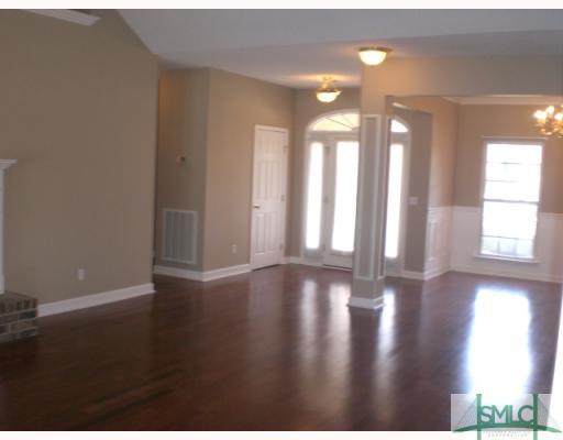 107 Legends Road Pooler, GA 31322 - Photo 3 of 8 Living Room. Beautiful hardwood floors flow throug