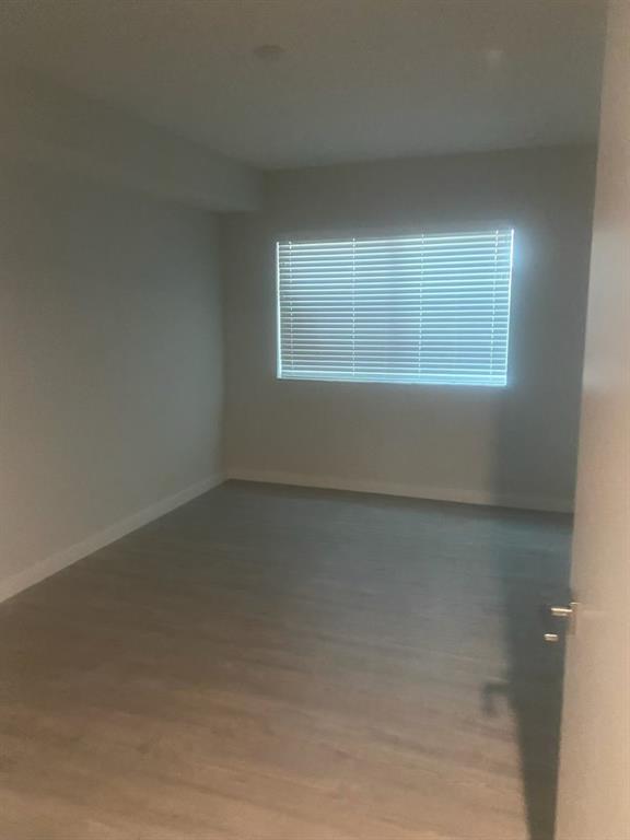 3050 Northwest 68th Street, Unit 2205 Fort Lauderdale, FL 33309 - Photo 13 of 19 an empty room with a window