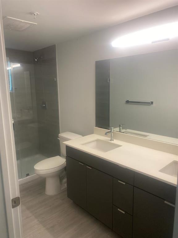 3050 Northwest 68th Street, Unit 2205 Fort Lauderdale, FL 33309 - Photo 19 of 19 a bathroom with a sink and a toilet