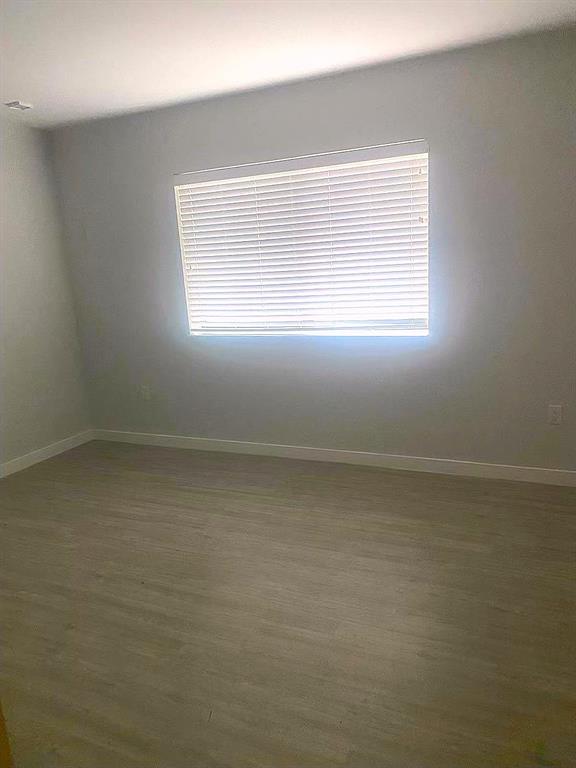 3050 Northwest 68th Street, Unit 2205 Fort Lauderdale, FL 33309 - Photo 10 of 19 a view of empty room with window