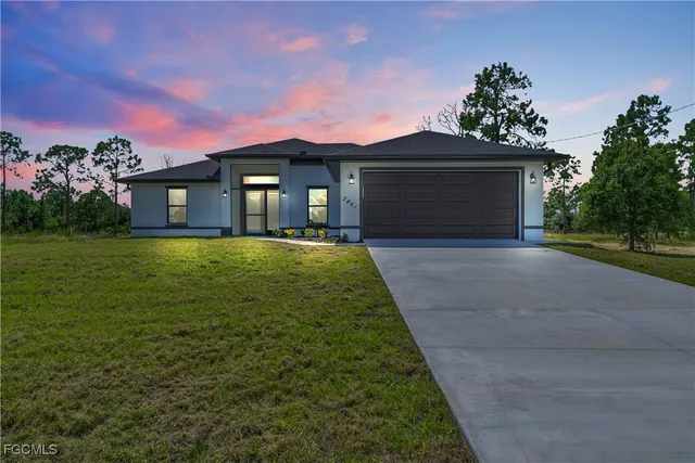 a front view of a house with yard
