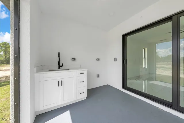 a bathroom with a sink and mirror