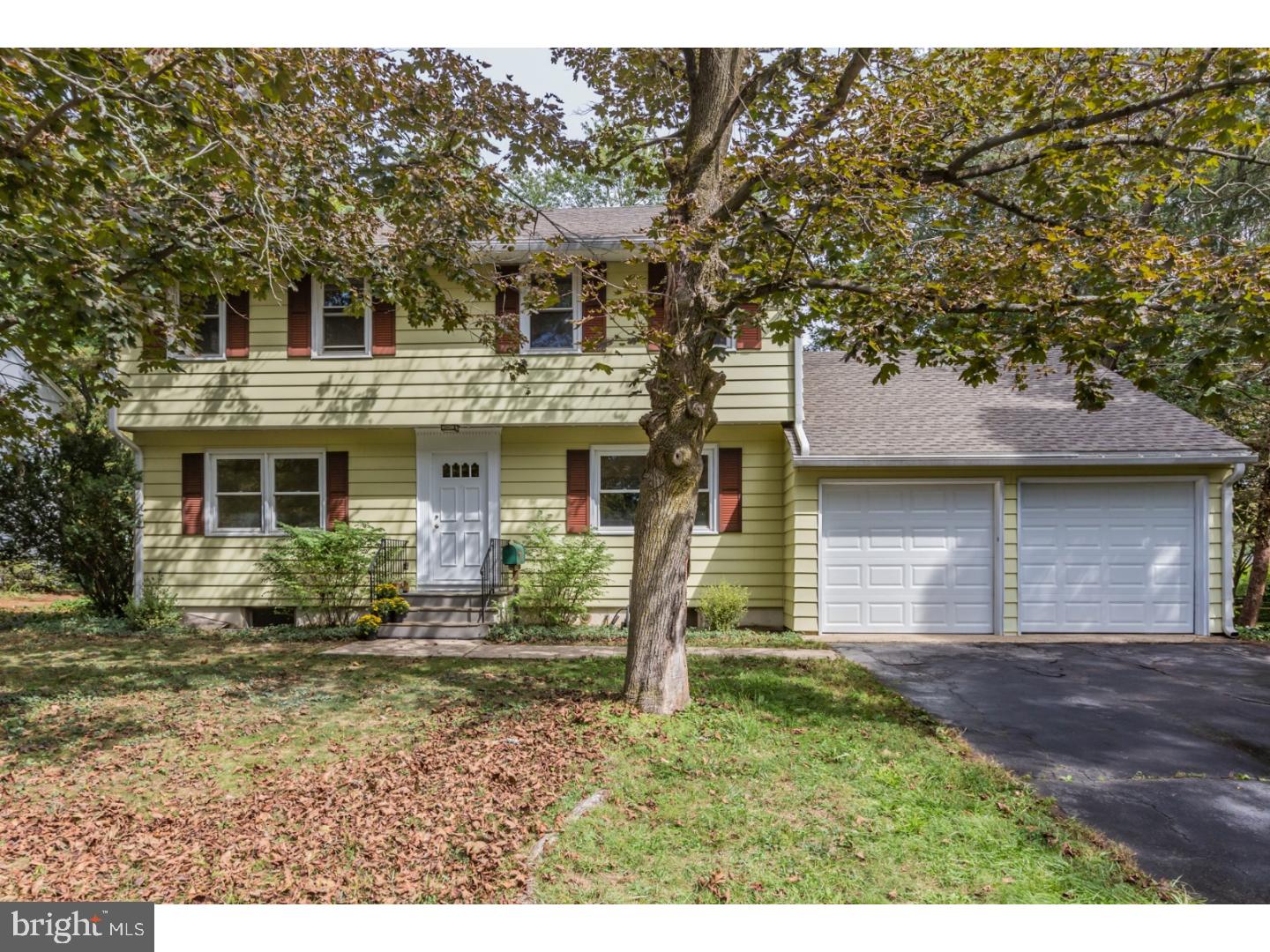 73 Robert Road Princeton, NJ 08540 - Photo 1 of 24 a front view of a house with garden