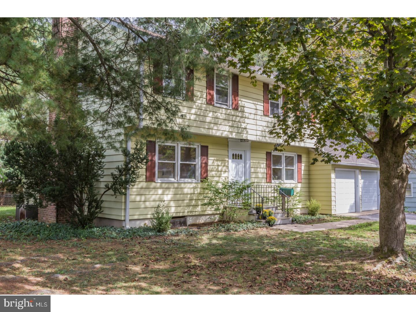 73 Robert Road Princeton, NJ 08540 - Photo 2 of 24 a front view of a house with garden