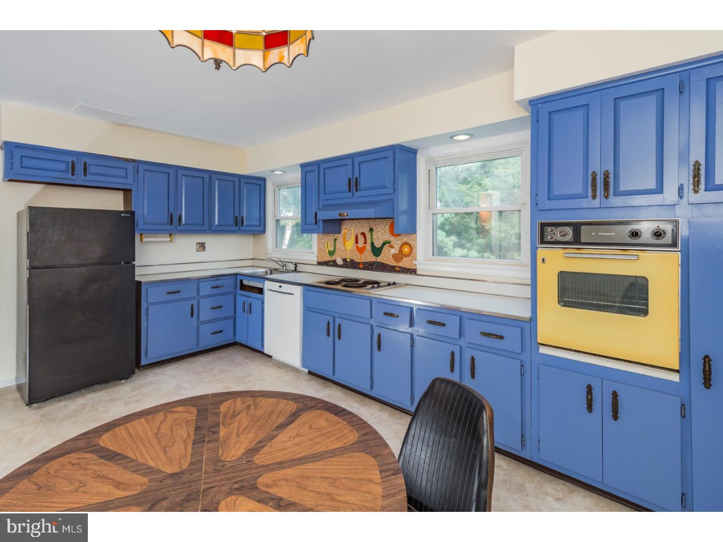 73 Robert Road Princeton, NJ 08540 - Photo 11 of 24 a kitchen with granite countertop wooden cabinets and a sink