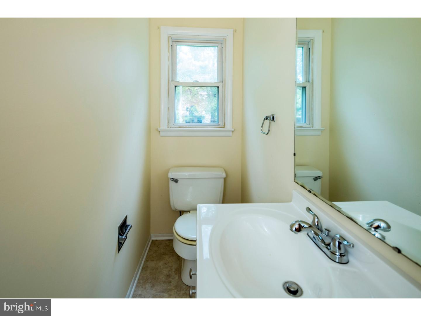 73 Robert Road Princeton, NJ 08540 - Photo 14 of 24 a bathroom with a sink a toilet and a mirror