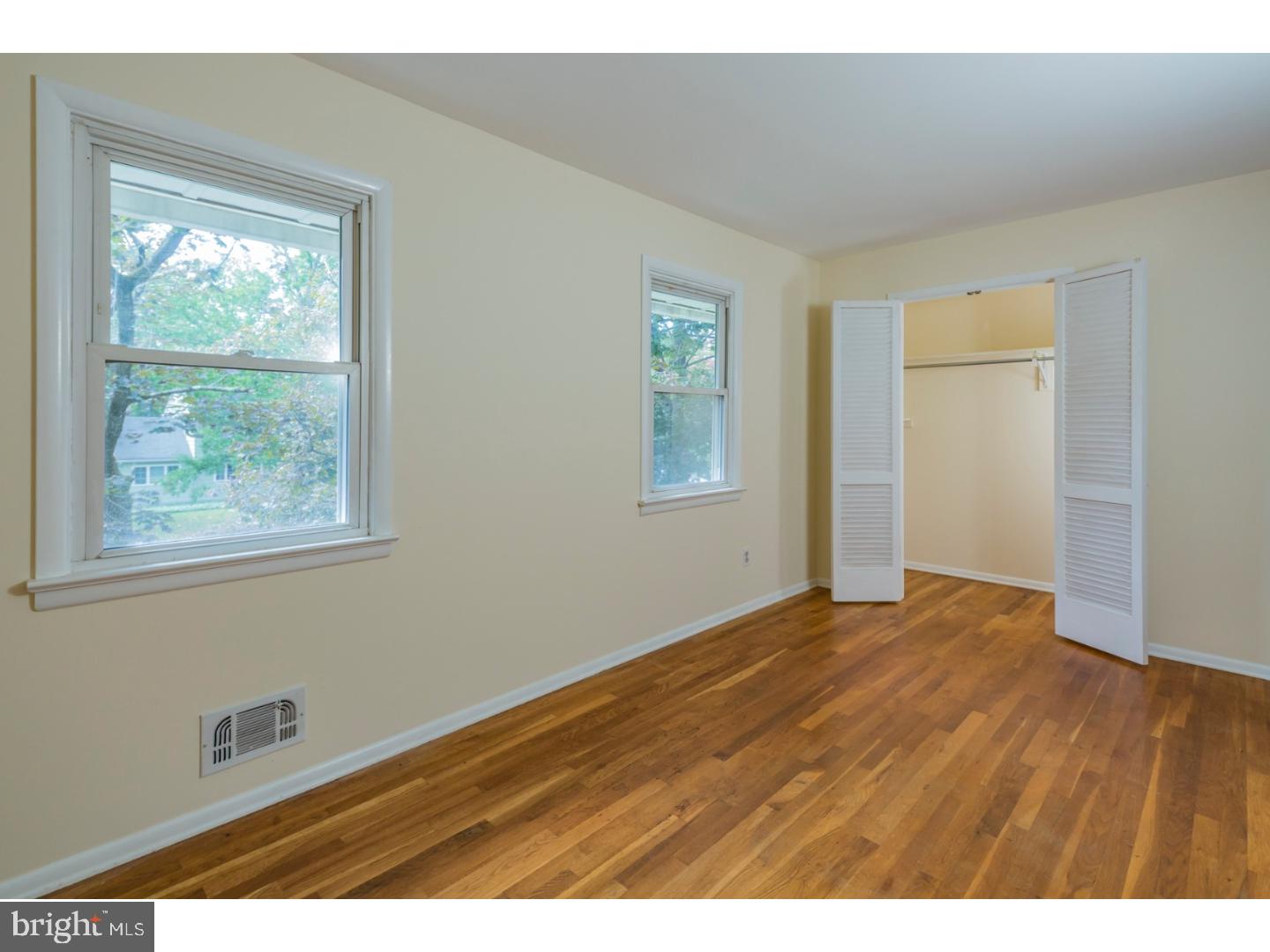 73 Robert Road Princeton, NJ 08540 - Photo 17 of 24 a view of an empty room with wooden floor and a window