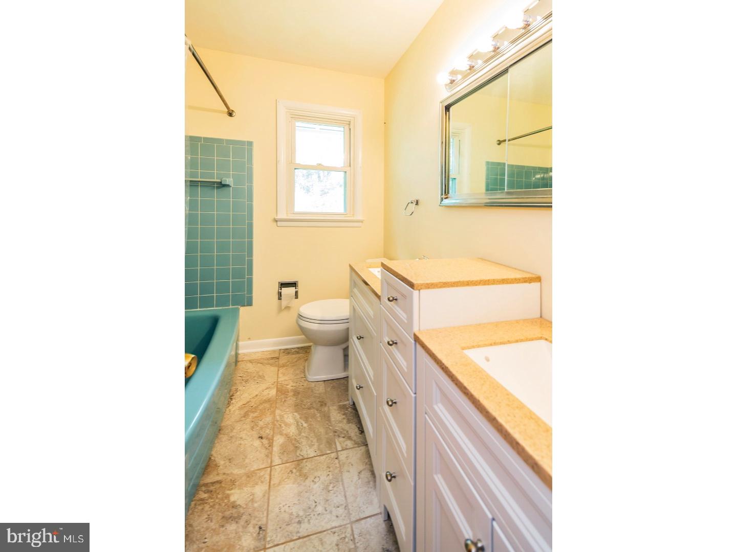 73 Robert Road Princeton, NJ 08540 - Photo 20 of 24 a bathroom with a sink a toilet and a window