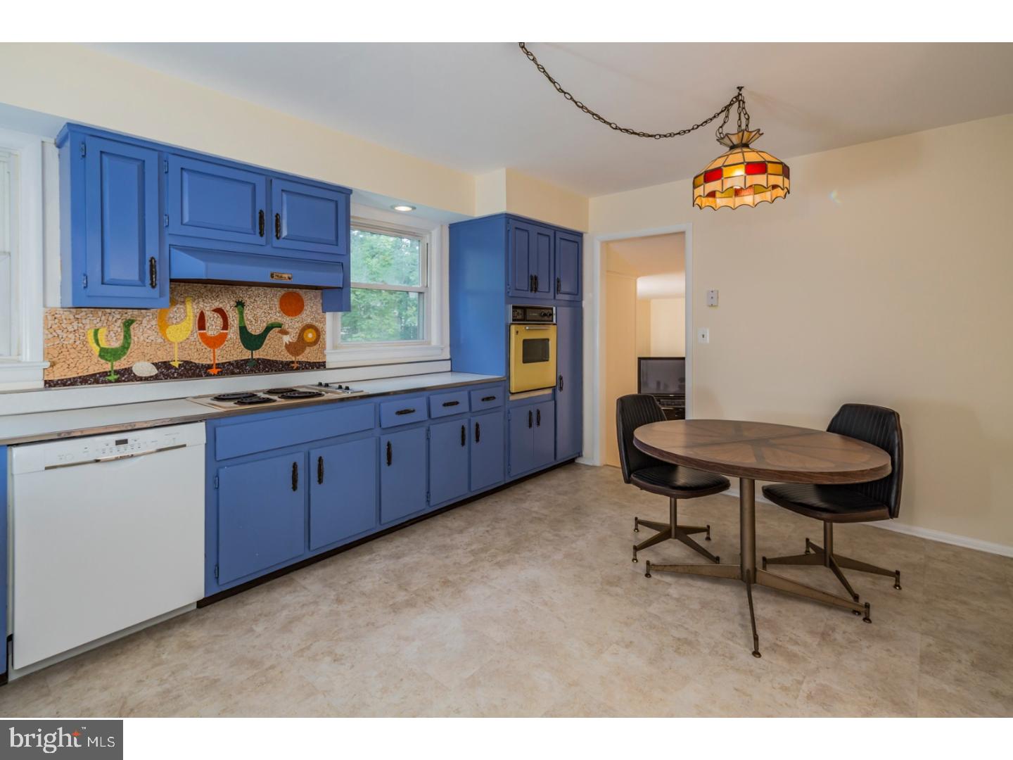 73 Robert Road Princeton, NJ 08540 - Photo 10 of 24 a kitchen with granite countertop wooden cabinets and entryway