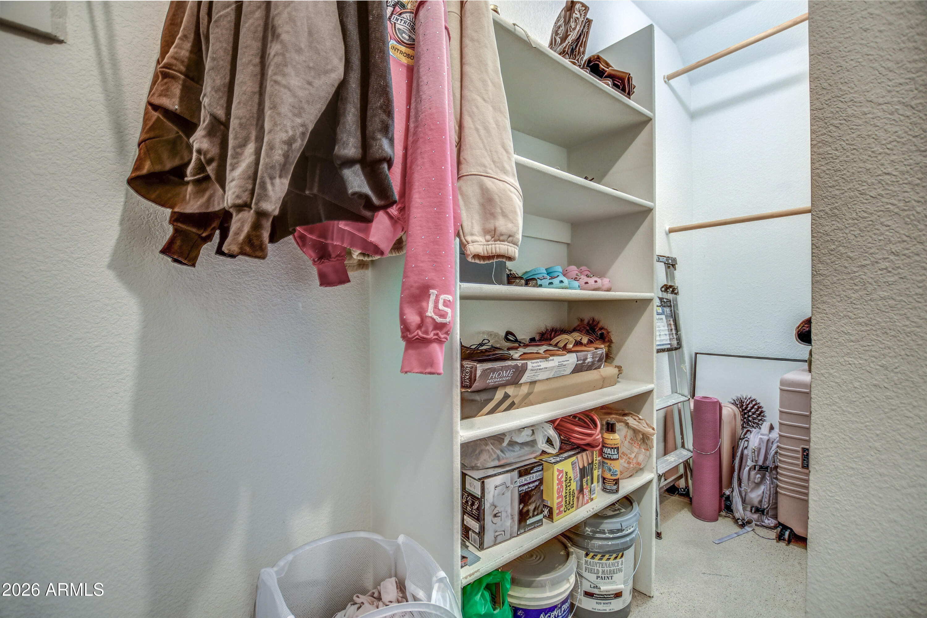 100 East Fillmore Street, Unit 117 Phoenix, AZ 85004 - Photo 19 of 20 a view of walk in closet with clothes and shoes