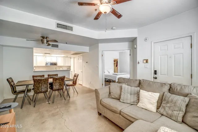 a living room with furniture and a large window